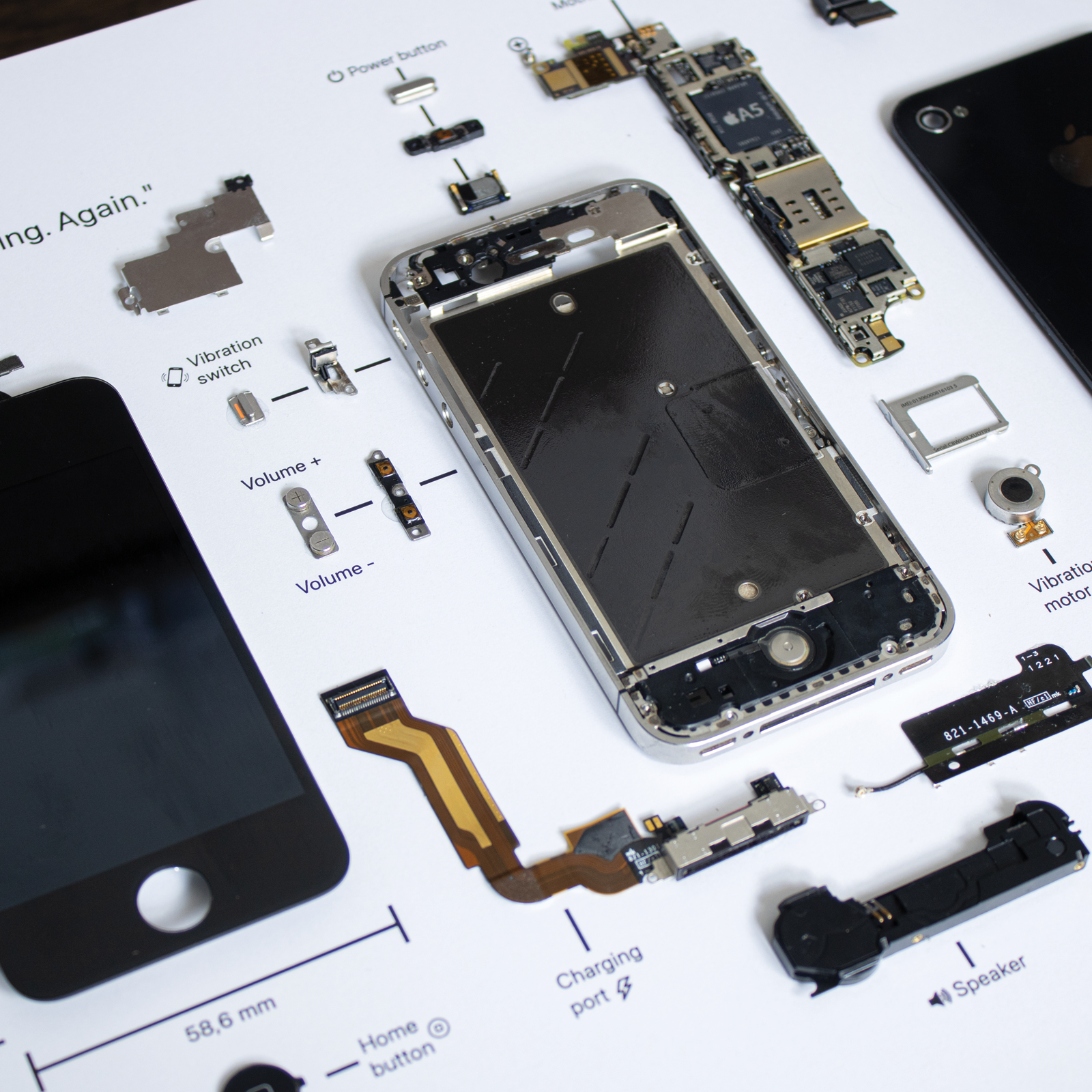 iPhone 4S disassembled in a frame